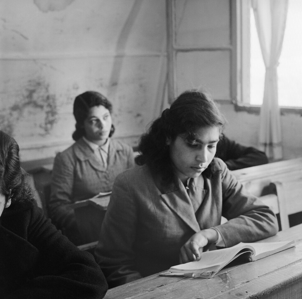 ubb-jg-n-0316-06: Two girls in a classroom as part of UNRWA's educational program. Gaza Strip, May 1957.
